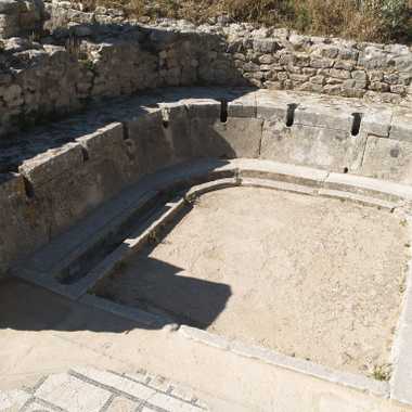 The stone latrines in the baths at Dougga.