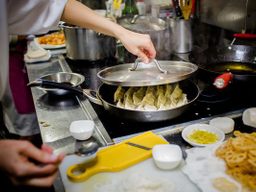 A Japanese nonna makes gyoza at Enoteca Maria.