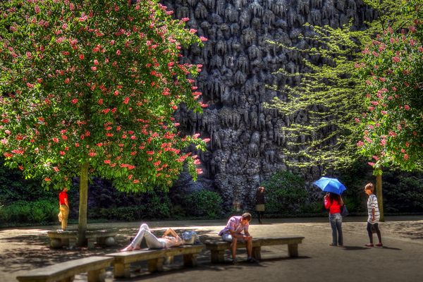 Visitors examine the Dripstone Wall for secret passageways